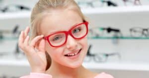 Young girl with red glasses